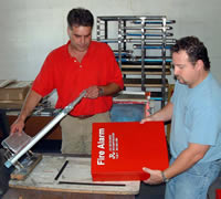 Mier Products can silk-screen your logo or graphic to your metal enclosure: Step 4, Ink is applied and dried.