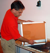 Mier Products can silk-screen your logo or graphic to your metal enclosure: Step 1, emulsion is placed on the screen.